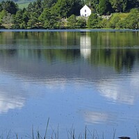 Buy canvas prints of View Across Loch Alvie to the Church by Charles Kelly