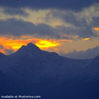Buy canvas prints of Firey Sunset over the Peaks of Arran by Charles Kelly