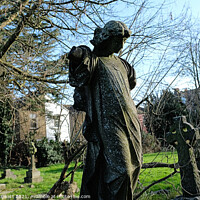Buy canvas prints of Stone Statue in Graveyard by Kevin Plunkett