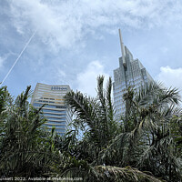 Buy canvas prints of Vietcombank Tower and Hilton Hotel. Ho Chi Minh City. Vietnam  by Kevin Plunkett
