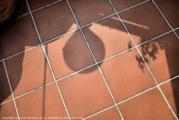 Shadows on floor tiles Picture Board by Kevin Plunkett