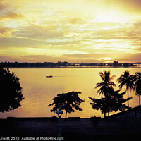 Buy canvas prints of Sunrise in Phnom Penh  by Kevin Plunkett