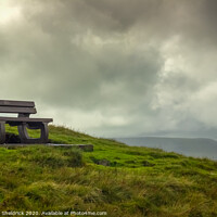 Buy canvas prints of Bench overlooking Pendle Hill in Lancashire by Heather Sheldrick
