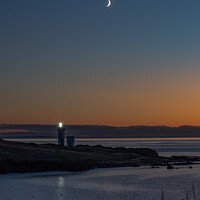 Buy canvas prints of Lighthouse Beacon at Dusk on a Wintry Headland by Ken Hunter