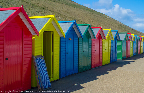 Row of Beach Huts at Whitby Picture Board by Michael Shannon