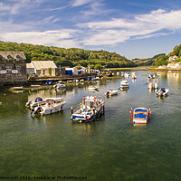Buy canvas prints of Boats moored on the river estuary, Looe, Cornwall by Michael Shannon