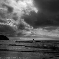 Buy canvas prints of Surfers in the sea at Perranporth in Cornwall by Michael Shannon