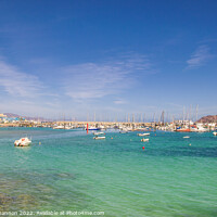 Buy canvas prints of Small boats moored in the bay, next to the harbour by Michael Shannon