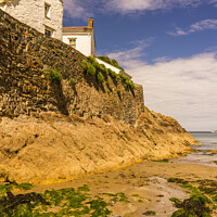 Buy canvas prints of Whitewashed Cottages and sea wall in Gorran Haven, by Michael Shannon