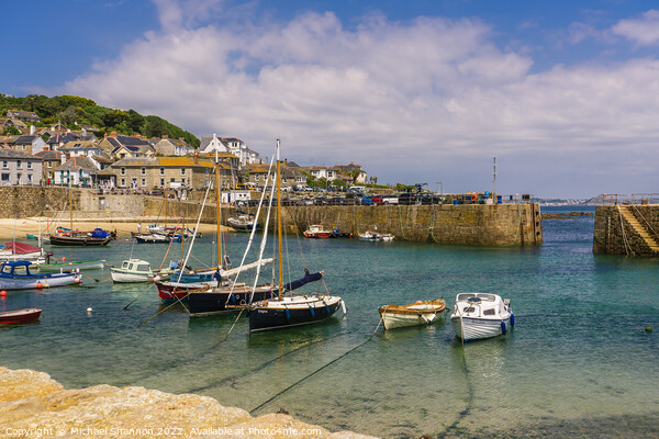 Yachts and small boats moored in Mousehole, Cornwa Picture Board by Michael Shannon