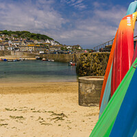 Buy canvas prints of Surfboards stacked in Mousehole harbour, Cornwall by Michael Shannon