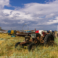 Buy canvas prints of Old tractors and boats near the beach at Skinningr by Michael Shannon