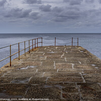 Buy canvas prints of Looking out to sea from the stone pier at Porthlev by Michael Shannon