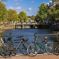 Buy canvas prints of Bridge, canal view and bikes - Amsterdam by Michael Shannon