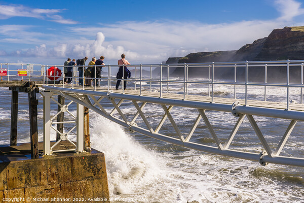 Wave watching from the East Pier in Whitby Picture Board by Michael Shannon
