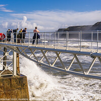 Buy canvas prints of Wave watching from the East Pier in Whitby by Michael Shannon