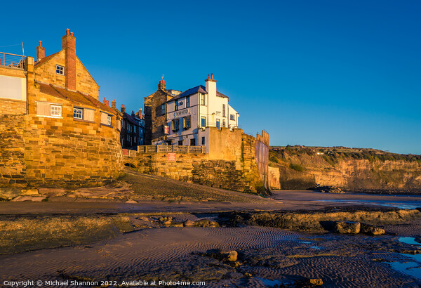 Robin Hoods Bay shot from the beach at low tide. Picture Board by Michael Shannon