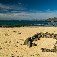 Buy canvas prints of Looking out to sea from one of Corralejo's beaches by Michael Shannon