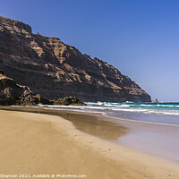 Buy canvas prints of The beach at Orzola near the cliffs of the Punta F by Michael Shannon