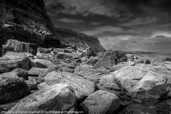 Boulders on Whitby East Beach Picture Board by Michael Shannon