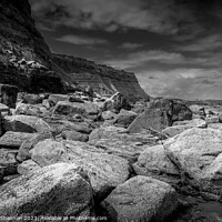 Buy canvas prints of Boulders on Whitby East Beach by Michael Shannon