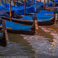 Buy canvas prints of Gondolas Moored at the side of the Grand Canal by Michael Shannon