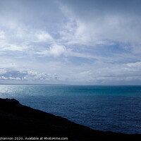 Buy canvas prints of Two figures silhouetted on top of the majectic cli by Michael Shannon