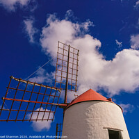 Buy canvas prints of Windmill and sails on a sunny day in Lanzarote, Ca by Michael Shannon
