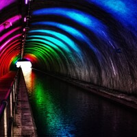 Buy canvas prints of Rainbow lit tunnel by Sarah Paddison