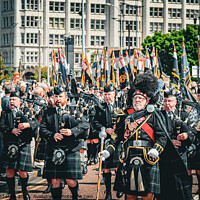 Buy canvas prints of Scottish Pipers during a parade by Sarah Paddison