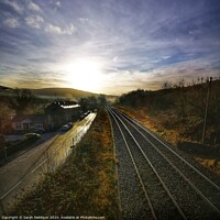 Buy canvas prints of Rail and road at sunrise, Mossley by Sarah Paddison