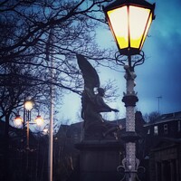 Buy canvas prints of War memorial with lamp by Sarah Paddison