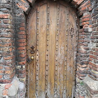 Buy canvas prints of Old Oak Studded Door  by Sheila Eames
