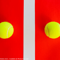 Buy canvas prints of two tennis balls divided by a field line by daniele mattioda