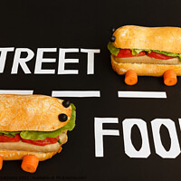 Buy canvas prints of two sandwiches   shaped  car  represent the activity of street food by daniele mattioda