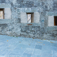 Buy canvas prints of series of slits of an ancient castle by daniele mattioda