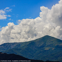 Buy canvas prints of a landscaping symmetry of mountains and clouds by susanna mattioda