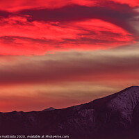 Buy canvas prints of a spectacular red cloud above the mountains by susanna mattioda