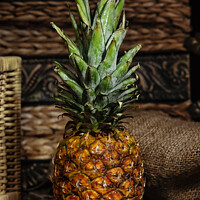 Buy canvas prints of Still life with pineapple on wooden rustic table. by Antonio Gravante