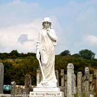 Buy canvas prints of Statue and graveyard by Fiona Williams
