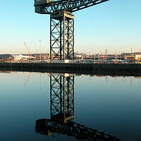 Buy canvas prints of Clydeport crane at sunrise by Fiona Williams