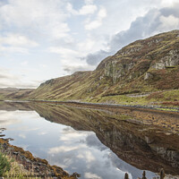 Buy canvas prints of Loch Reflections on a Cloudy day  Isle of Skye  Scotland by Iain Gordon
