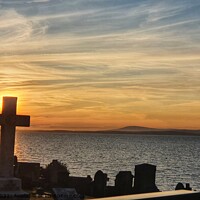 Buy canvas prints of Sunset cross by Zoe Rawcliffe