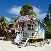 Buy canvas prints of Traditional Beach Shop Roatan Island Honduras by Sheila Ramsey