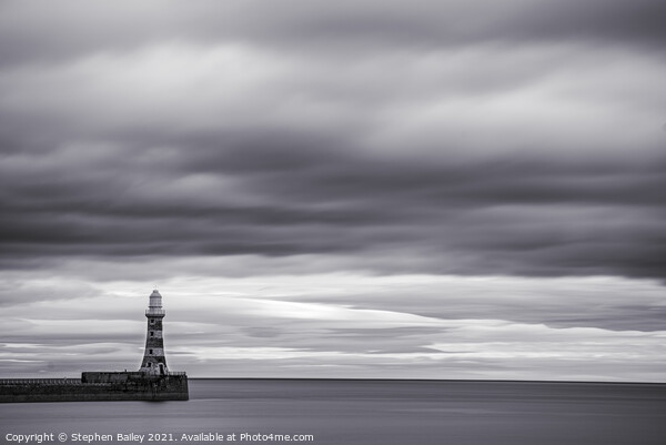 Moody skies over Roker Lighthouse Picture Board by Stephen Bailey