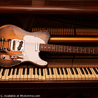 Buy canvas prints of Vintage Fender Telecaster electric guitar on piano by Helen Jones