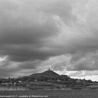 Buy canvas prints of Storm clouds gather over Glastonbury Tor by Robert MacDowall