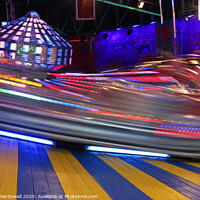 Buy canvas prints of Fairground ride by night - long exposure by Robert MacDowall
