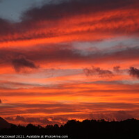 Buy canvas prints of Evening flame sky over Setubal, Portugal by Robert MacDowall