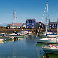 Buy canvas prints of Charming Harbourmaster Hotel in Vibrant Welsh Coas by Janet Carmichael